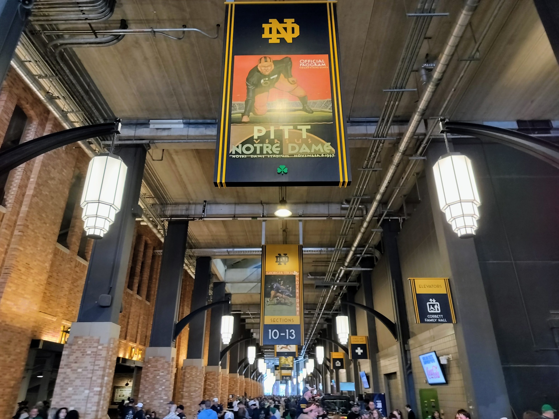 Concourse inside Notre Dame Stadium with vintage program banners